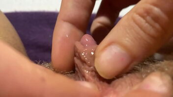 Solo masturbation with extreme close up shots of a puffy and wooly pussy