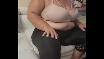 The enigmatic BBW mature woman, a latina MILF, shows her big ass and exposes her breasts.