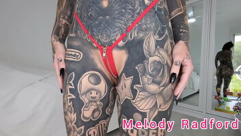 Melody Radford’s lil' bikini try-on haul in ebony and red zipper bikinis.