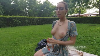 Beautiful lady demonstrating her great congenital tits in the park