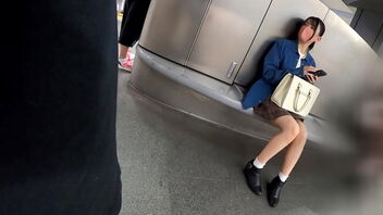 A young damsel with dark-hued hair walks around Shibuya and shows off her beautiful legs.